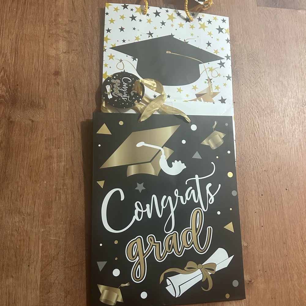 Two paper graduation bags ..